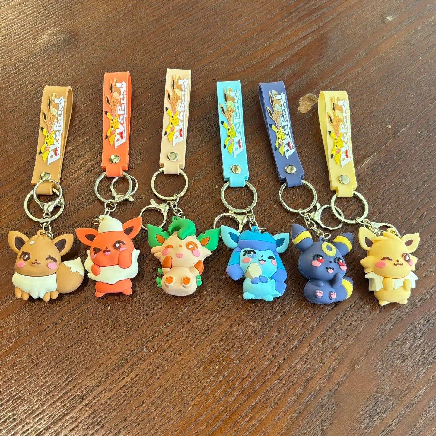 Pokémon Eevee Family Keychain Gift Set, Complete Evolution Plush Keychain with Official Pokéball Clip, Adorable Key Ring for Kid
